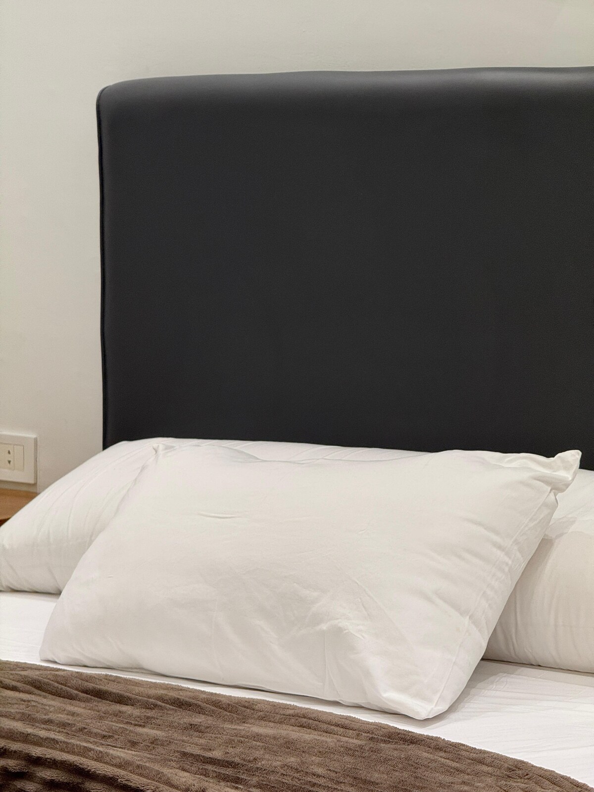 Master bedroom — headboard and pillows